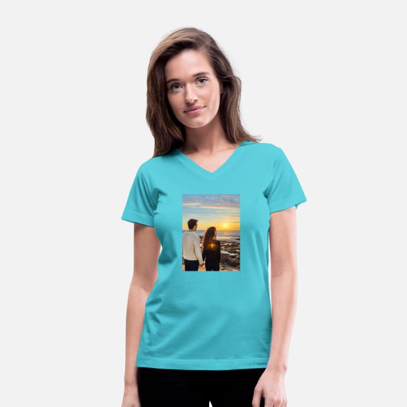 Couple Hand In Hand On Sandy Beach At Sunset