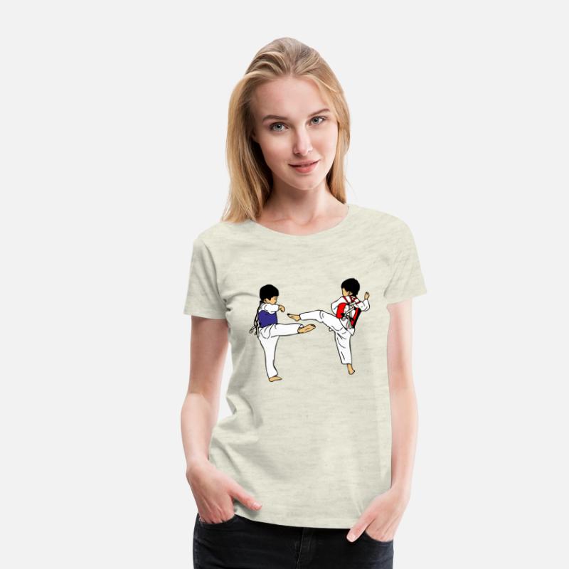 Two taekwondo kids sparring