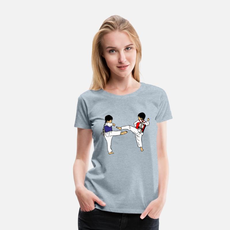 Two taekwondo kids sparring